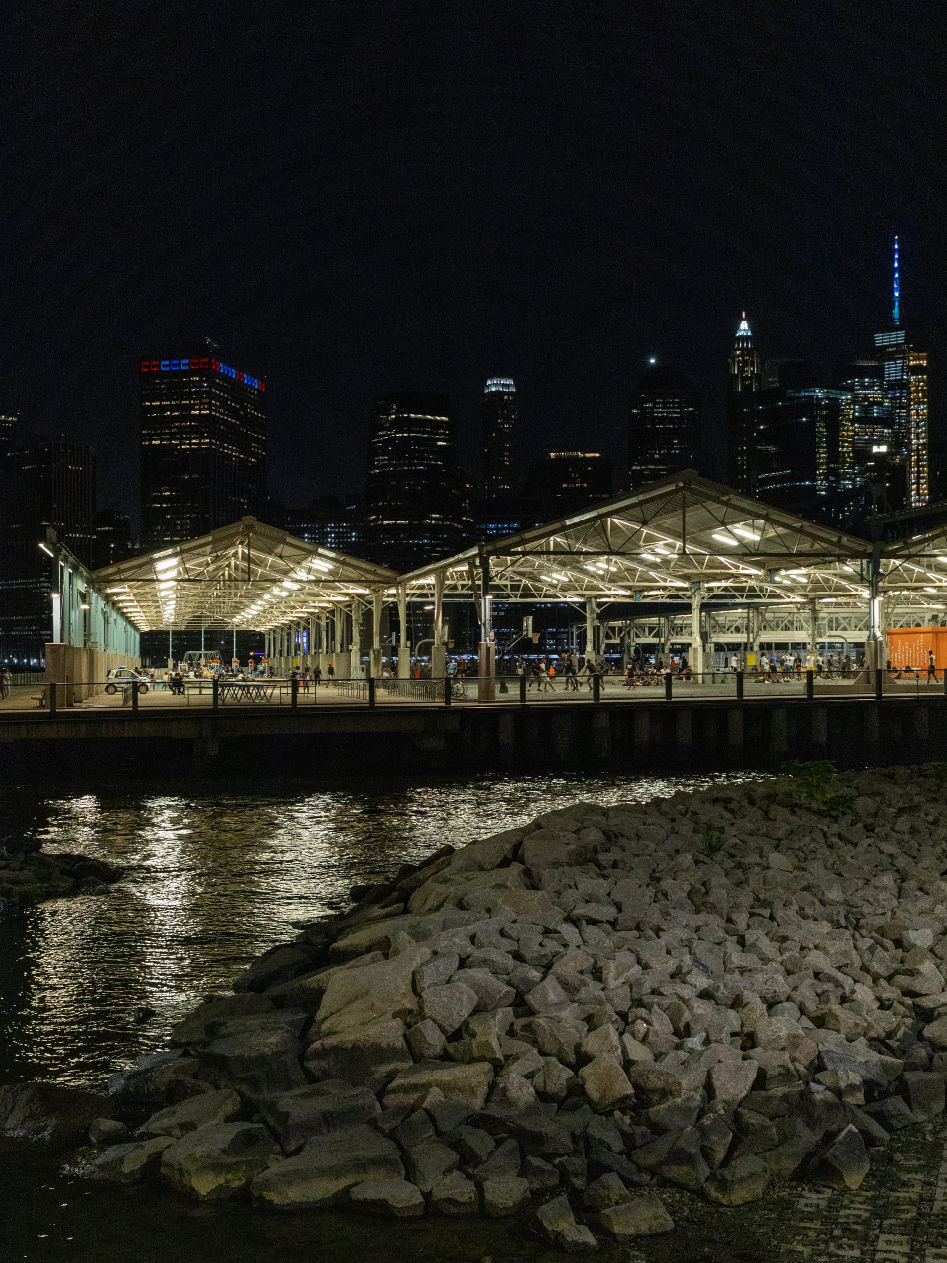 View of Pier 2 at night from the rocks by the Greenway path.