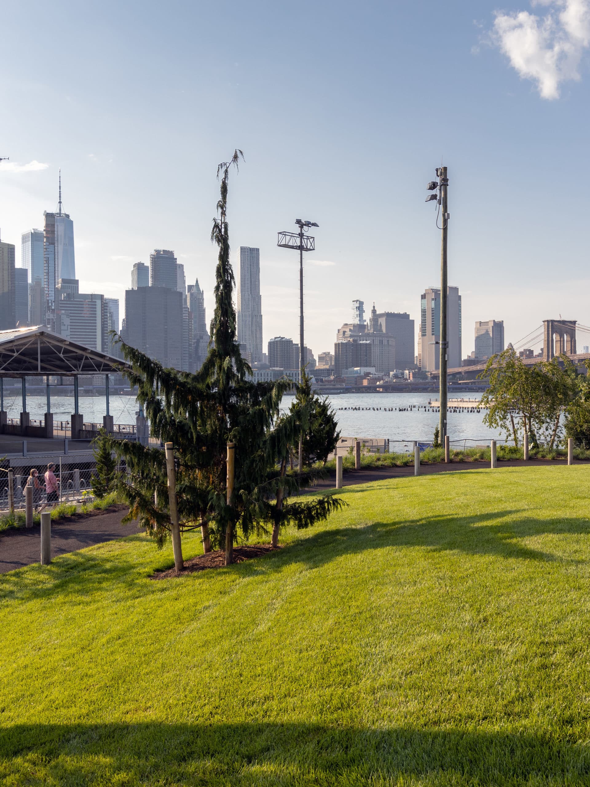 Pier 2 Uplands Lawn with view of water and lower Manhattan.