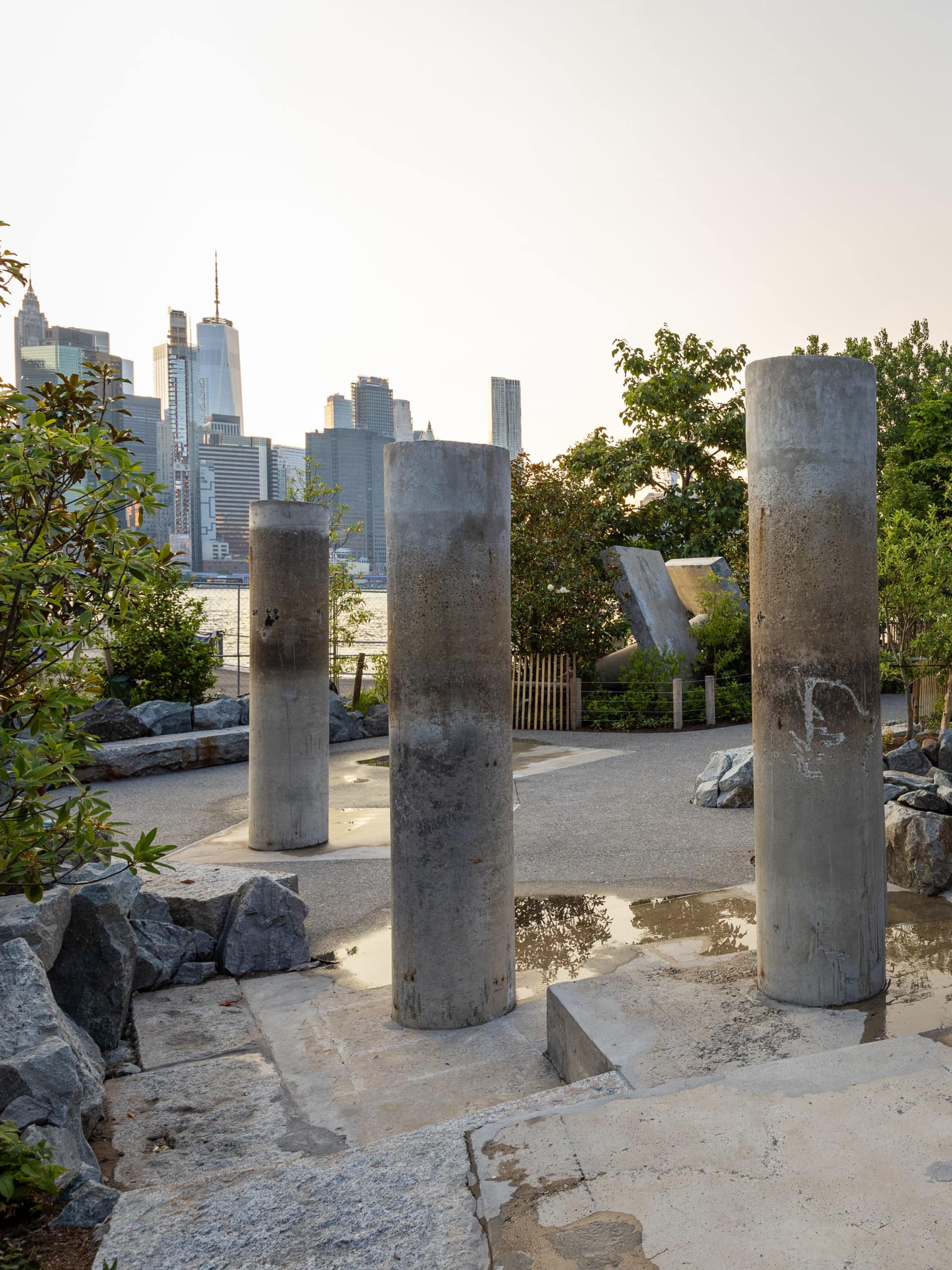 Concrete piles in the Water Area at sunset with a view of lower Manhattan