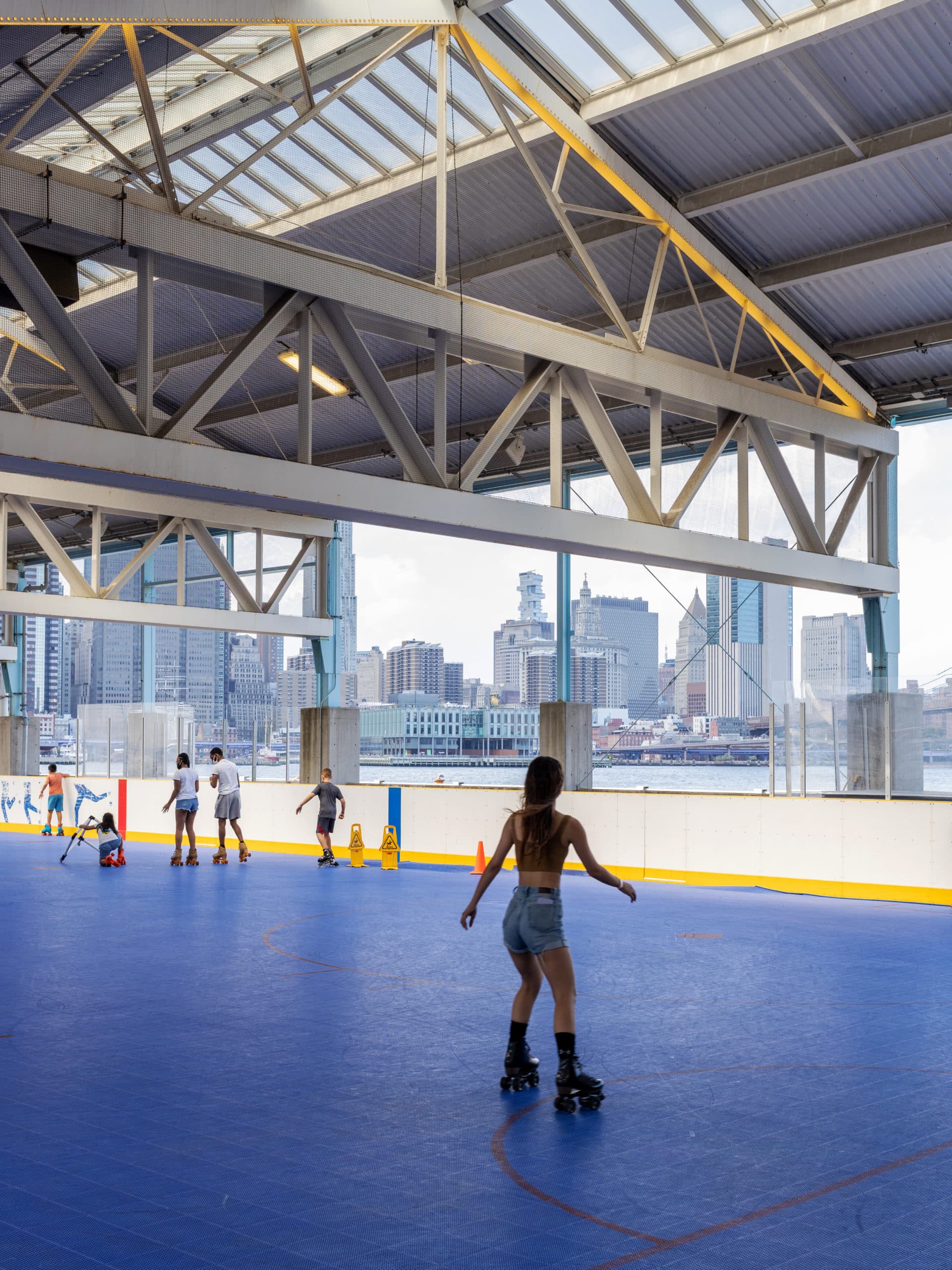 Girl skating in the rink under the roof at Pier 2.