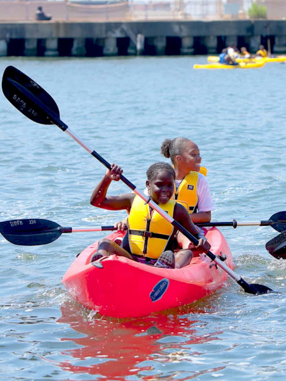 Close up of two girls in a kayak.