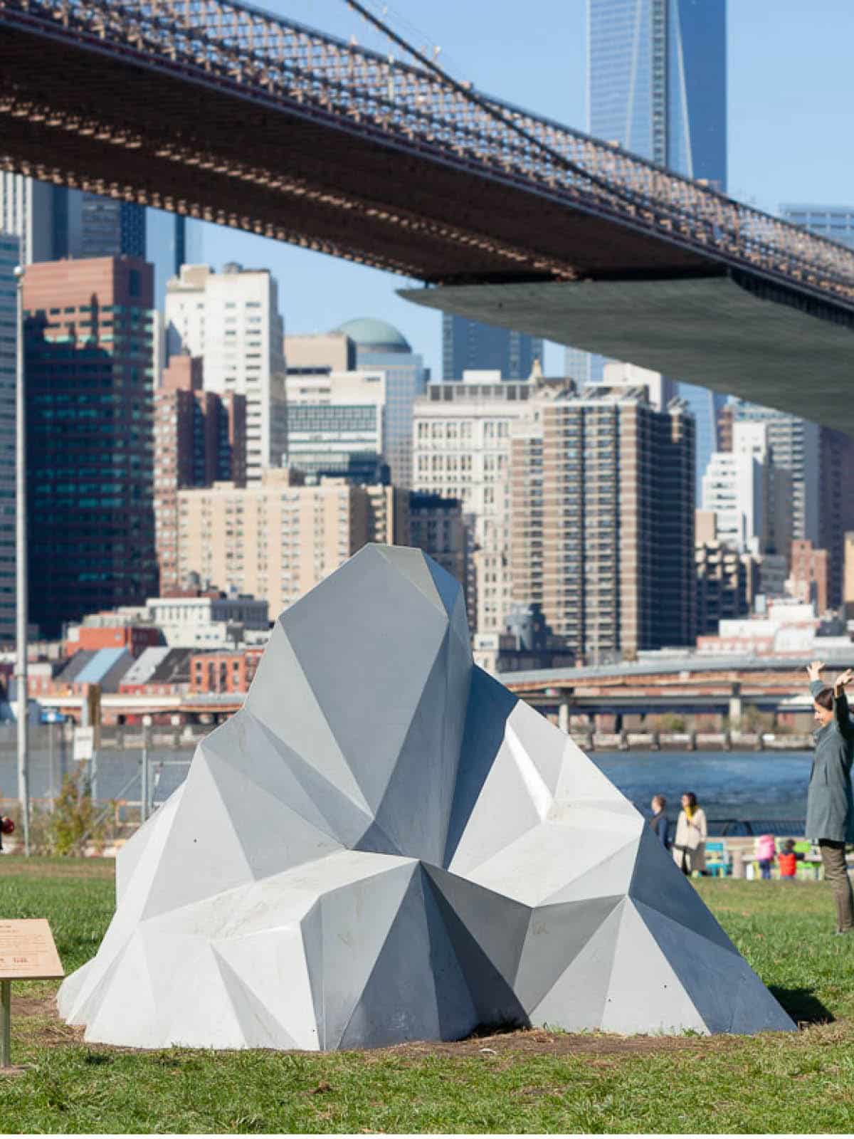 Grayson Cox: Half Story Mountain sculpture on the Empire Fulton Ferry Lawn on a sunny day.