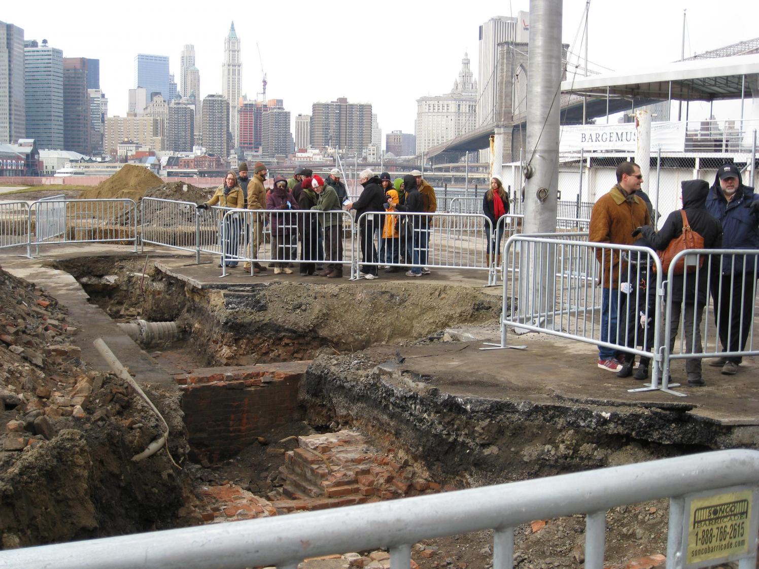 Spectators observe the foundations of the Jewell Milling Company in 2008